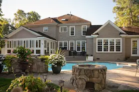 Backyard greenery and swimming pool.