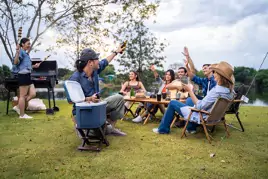 group of friends enjoying an outdoor party without pests thanks to mosquito joe